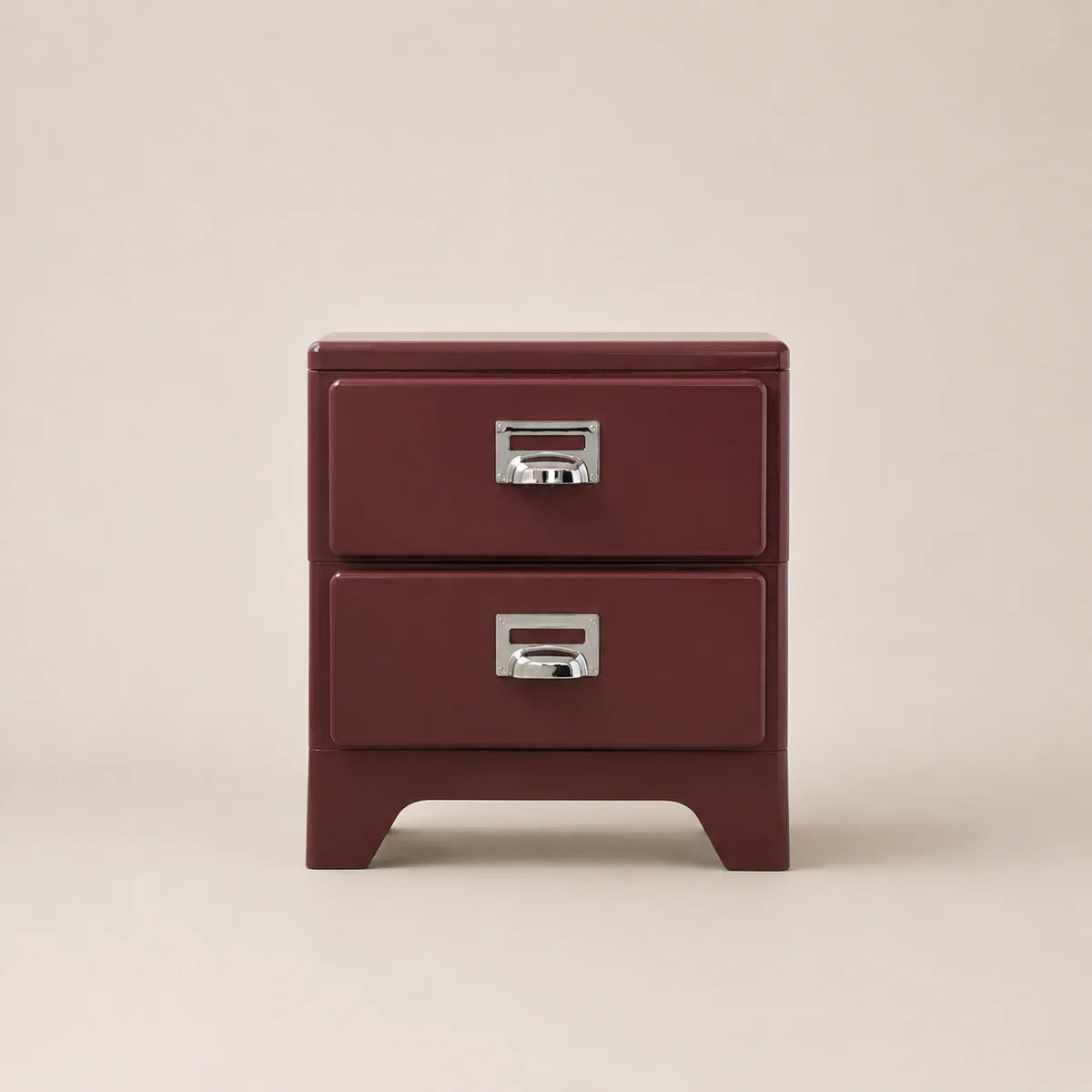 Red two-drawer nightstand with silver handles on a beige background