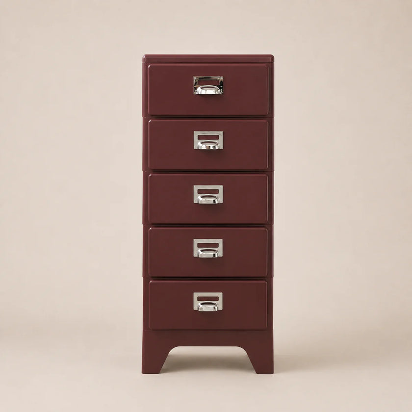Red metal file cabinet with four drawers on a beige background