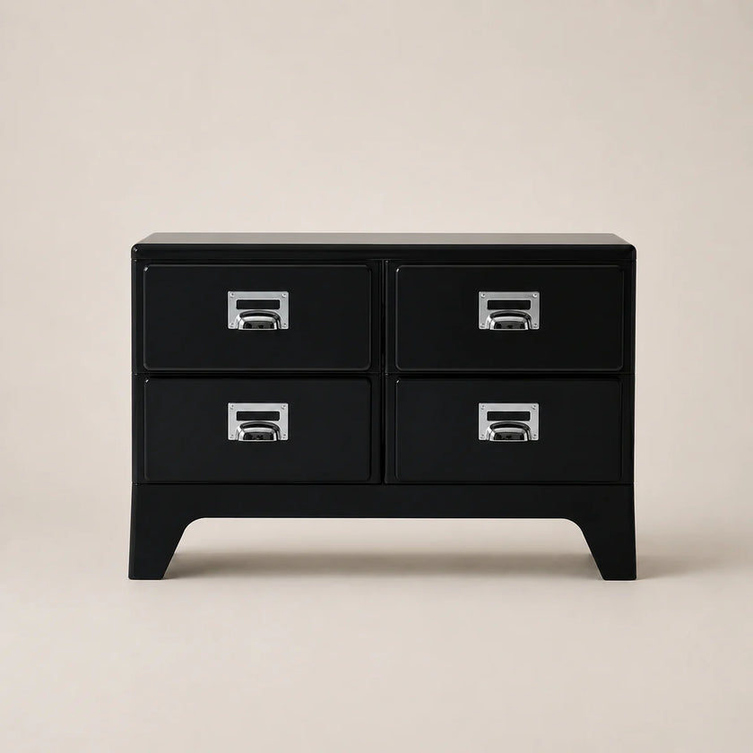 Black dresser with four drawers on a beige background