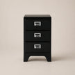 Black three-drawer filing cabinet on a beige background