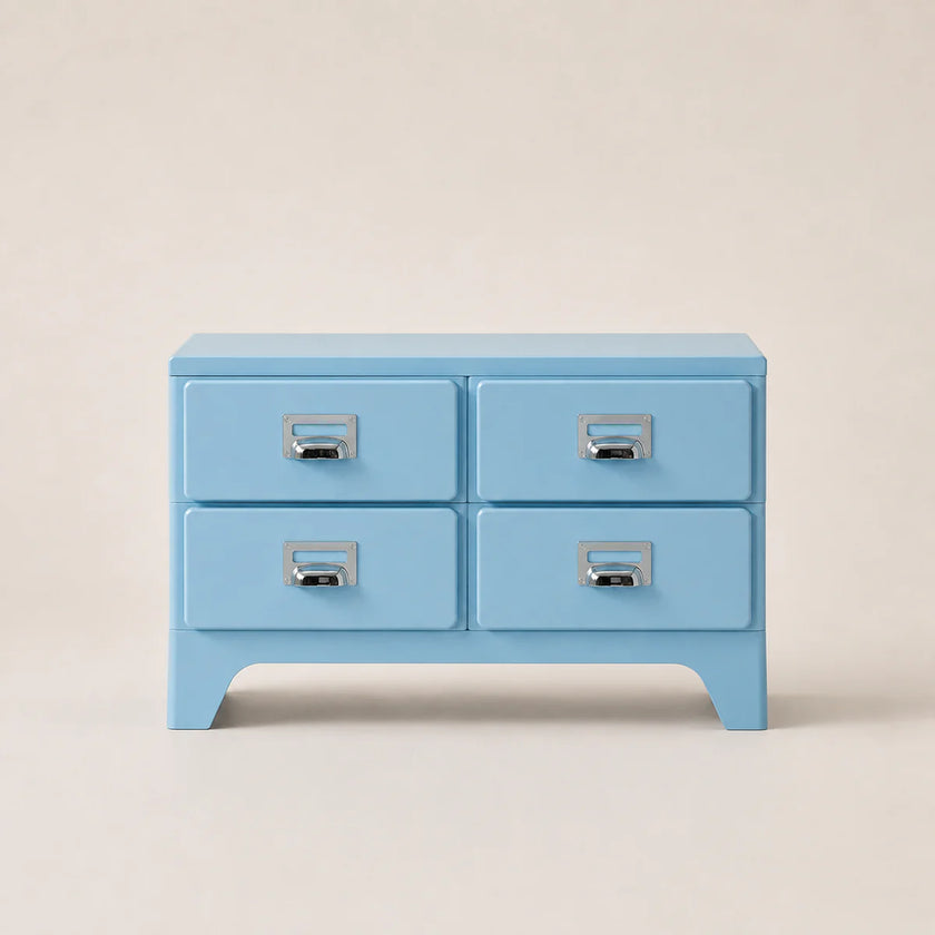 Light blue four-drawer chest with silver handles on a beige background