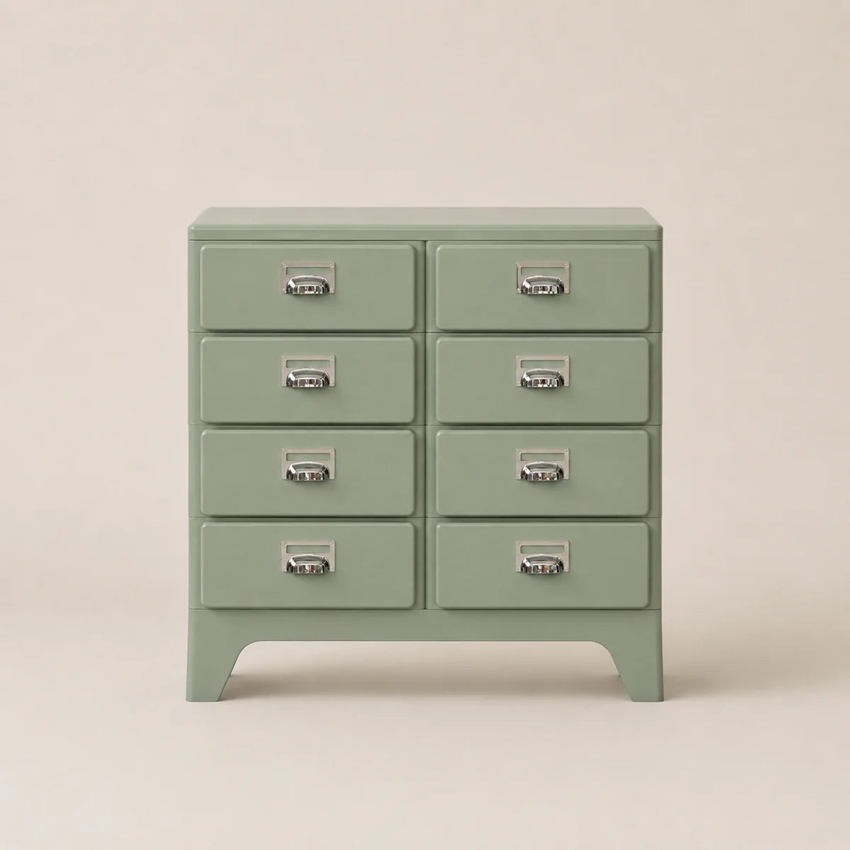 Green dresser with multiple drawers on a beige background