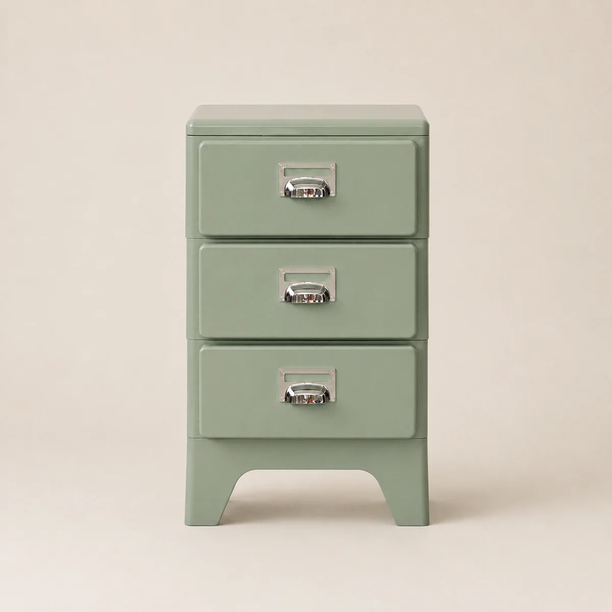Green three-drawer nightstand with metallic handles on a beige background