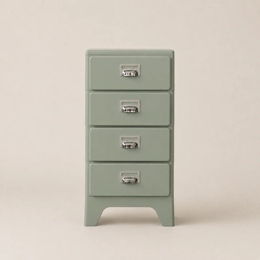 Green chest of drawers with four drawers on a beige background