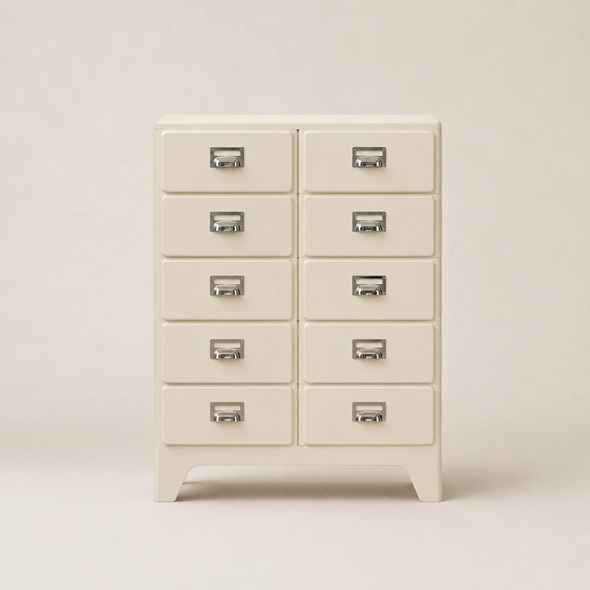 White dresser with multiple drawers on a beige background