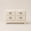 Beige dresser with four drawers on a beige background