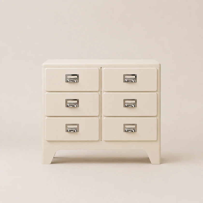 Beige dresser with silver handles on a beige background