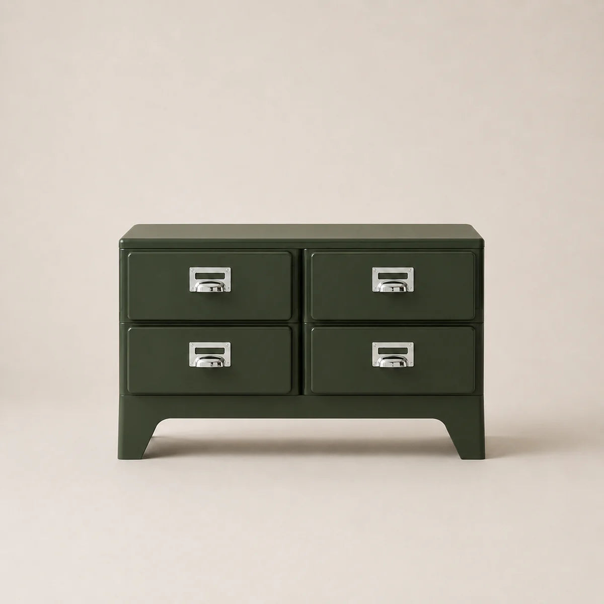 Green four-drawer chest with silver handles on a beige background