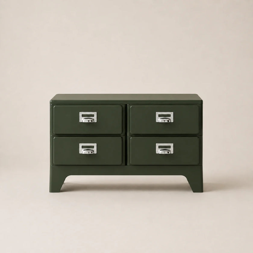 Green four-drawer chest with silver handles on a beige background