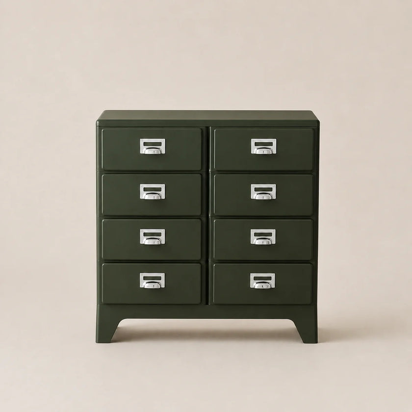 Green metal cabinet with multiple drawers on a beige background