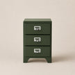 Green three-drawer filing cabinet on a beige background