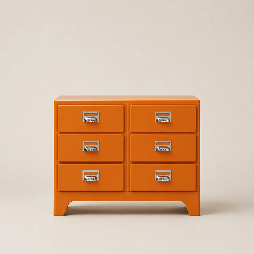Orange dresser with silver handles on a beige background