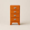 Orange four-drawer chest with silver handles on a beige background