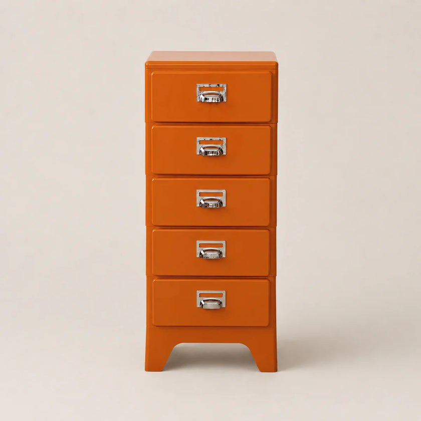Orange dresser with silver handles on a beige background