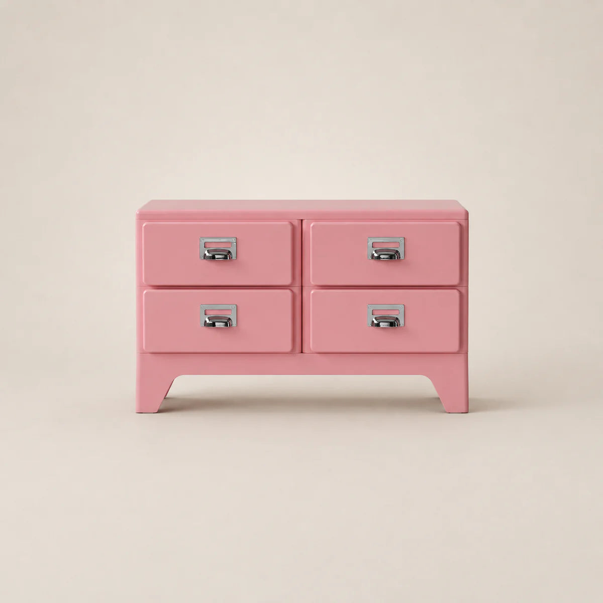 Pink dresser with four drawers on a beige background