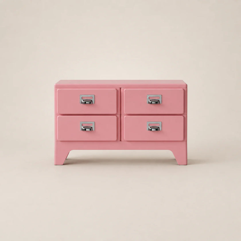 Pink dresser with four drawers on a beige background
