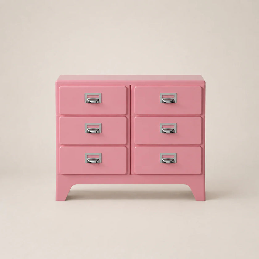 Pink dresser with six drawers on a beige background
