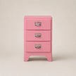 Pink three-drawer jewelry box with silver handles on a beige background