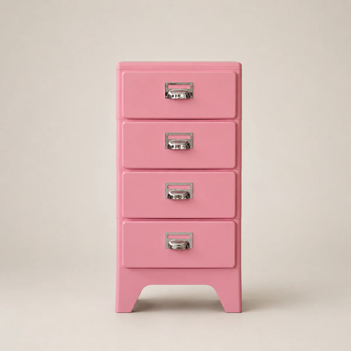 Pink four-drawer cabinet with silver handles on a beige background