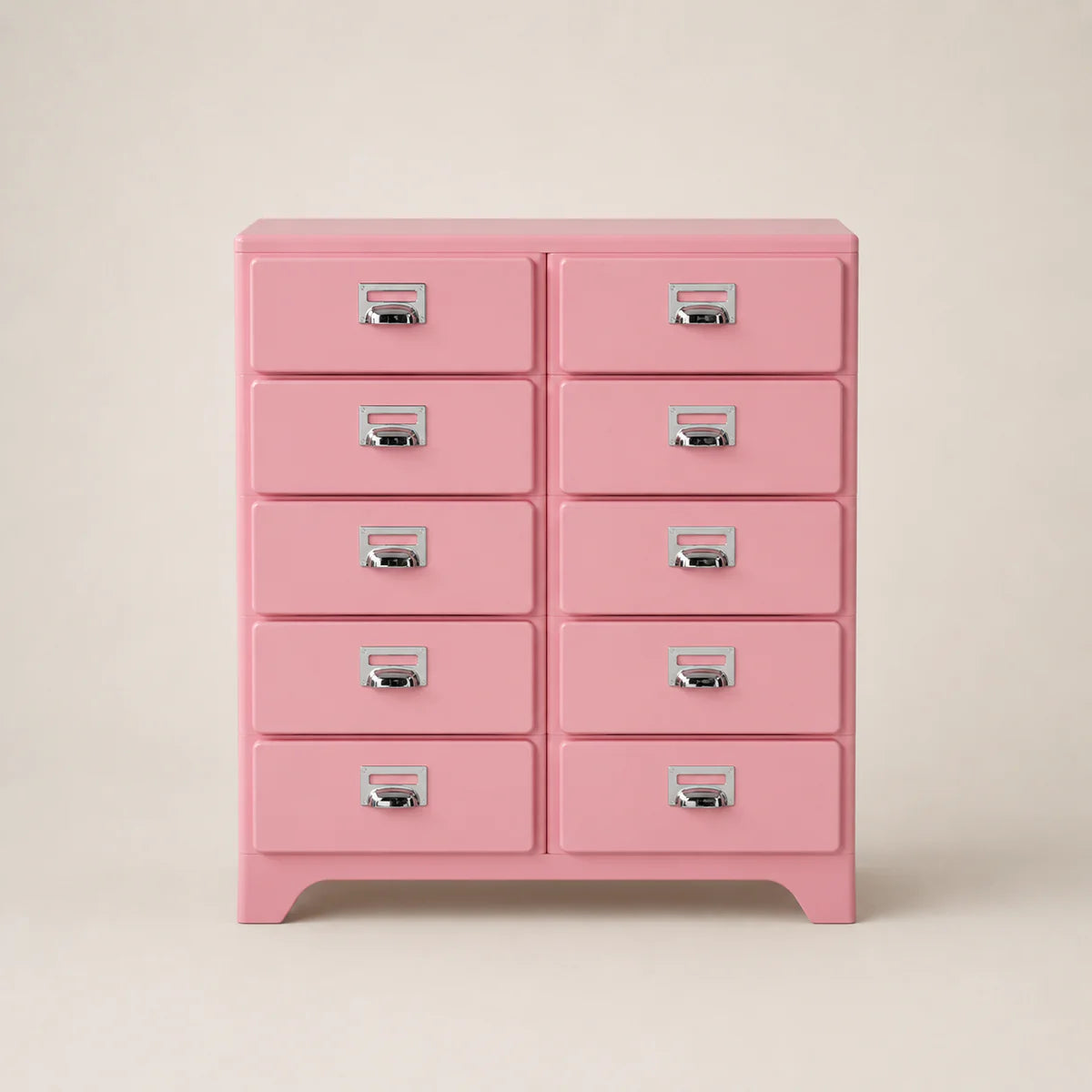 Pink dresser with multiple drawers on a beige background