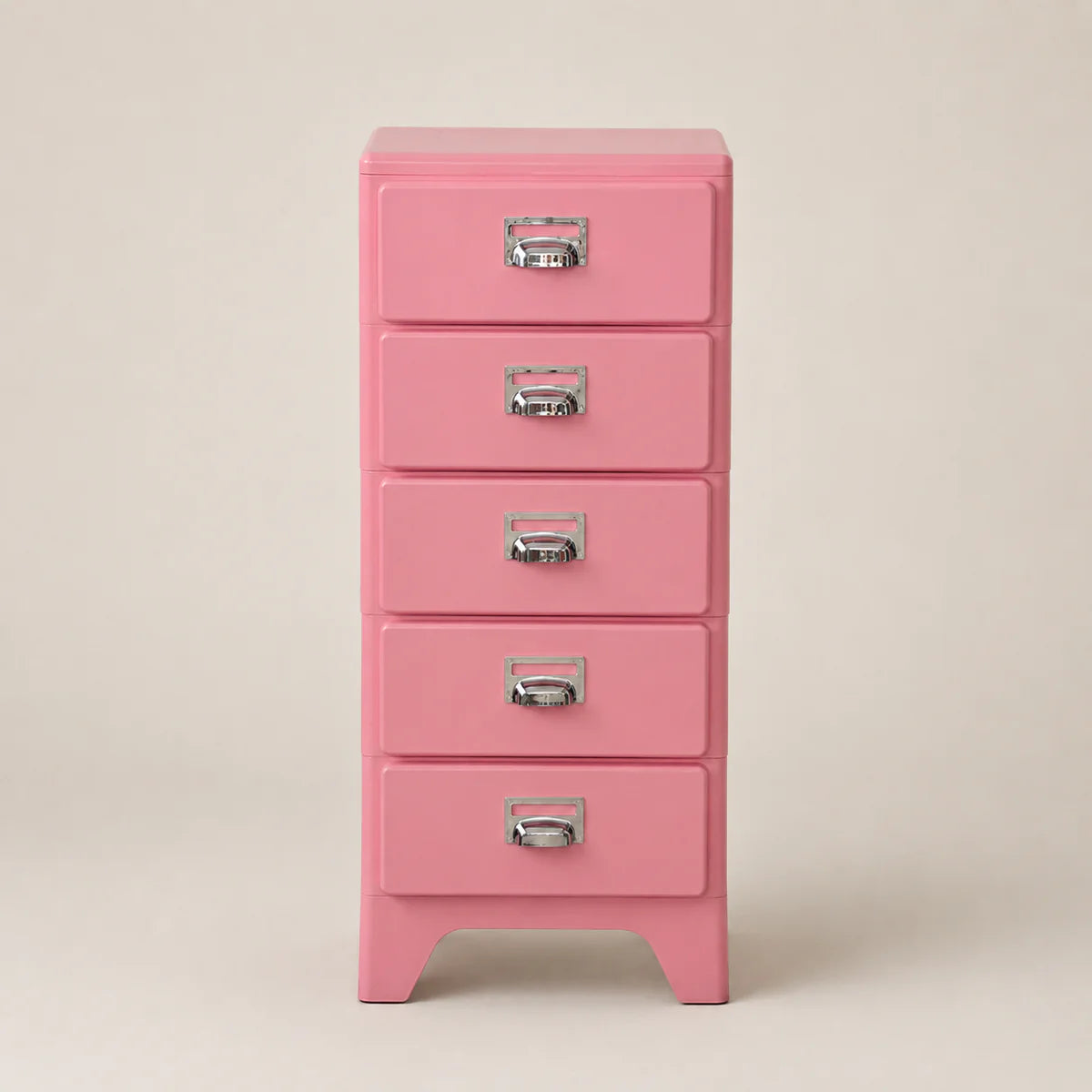Pink five-drawer chest with silver handles on a beige background