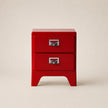 Red two-drawer nightstand with metal handles on a beige background