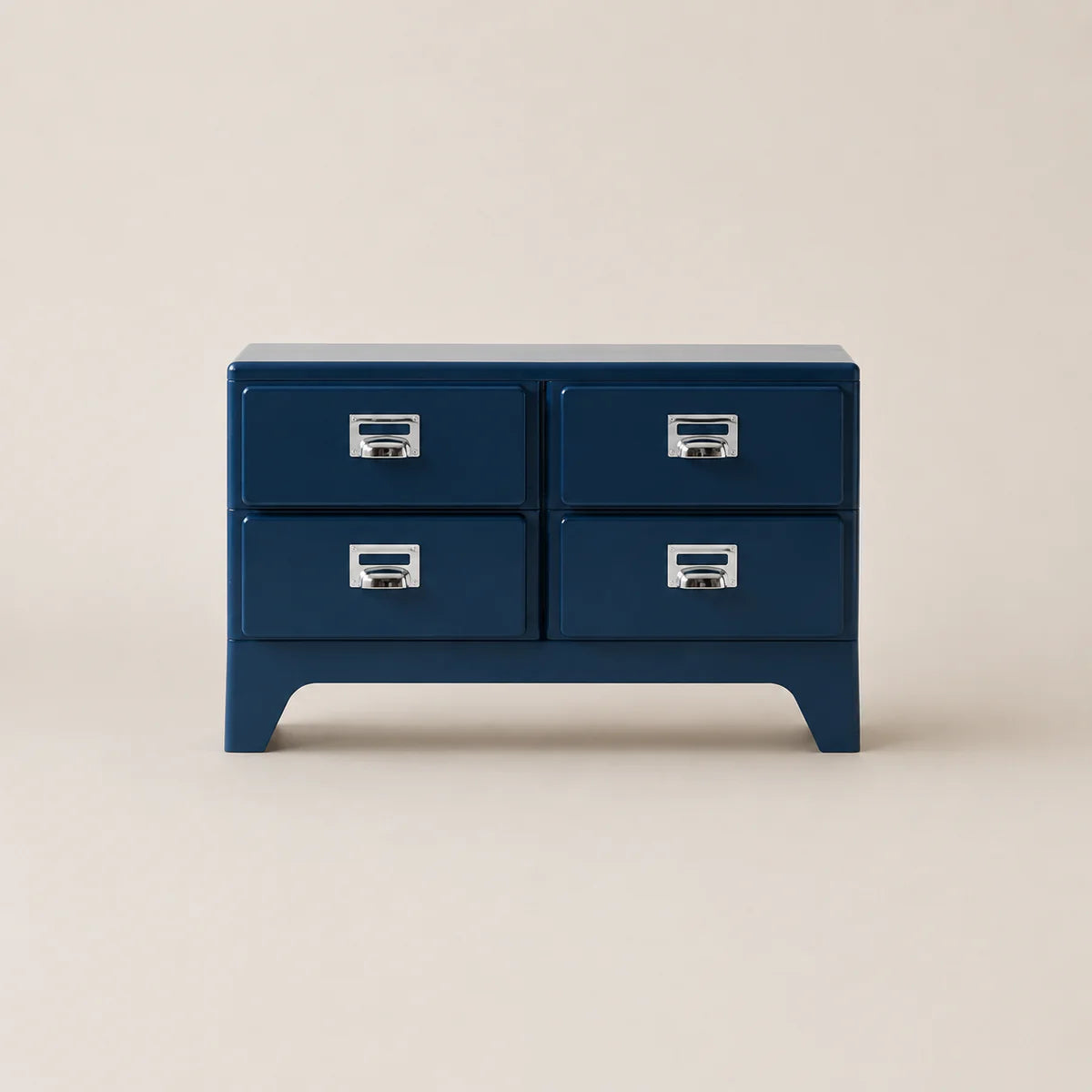 Blue dresser with four drawers on a beige background