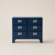 Blue dresser with six drawers on a beige background