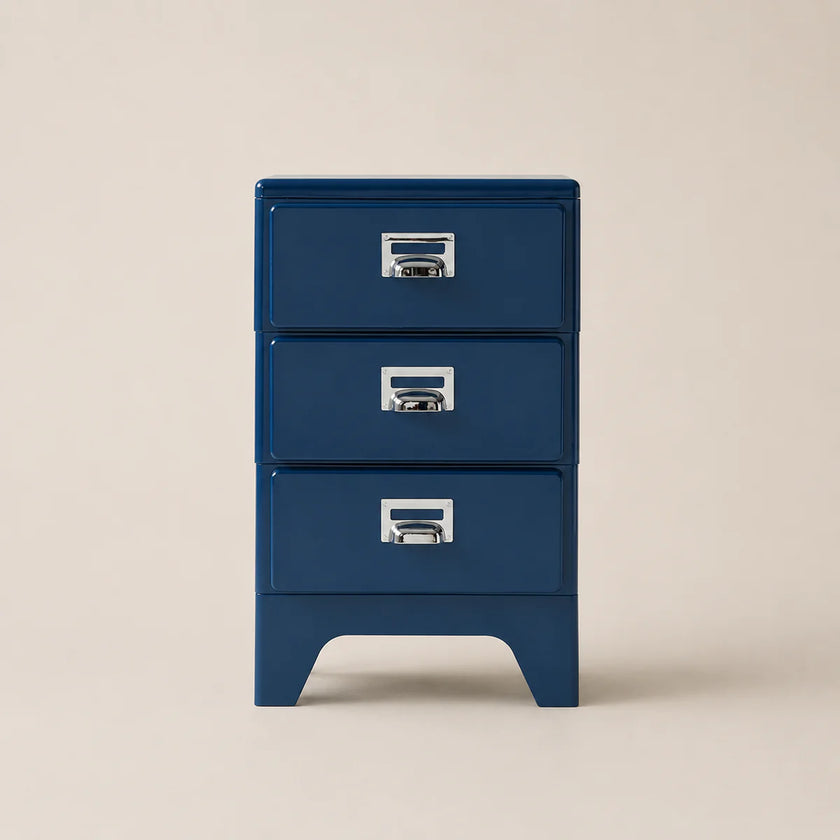 Blue three-drawer nightstand with silver handles on a beige background