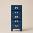 Blue metal file cabinet with four drawers on a beige background
