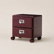 Two-drawer filing cabinet with wheels on a beige background