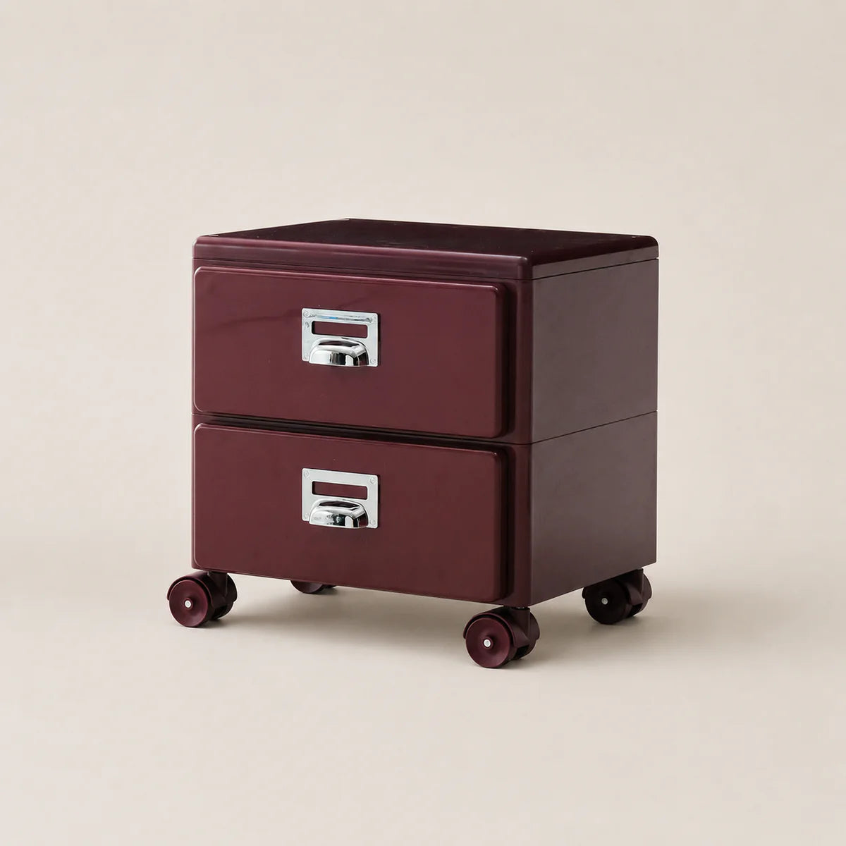 Two-drawer filing cabinet with wheels on a beige background
