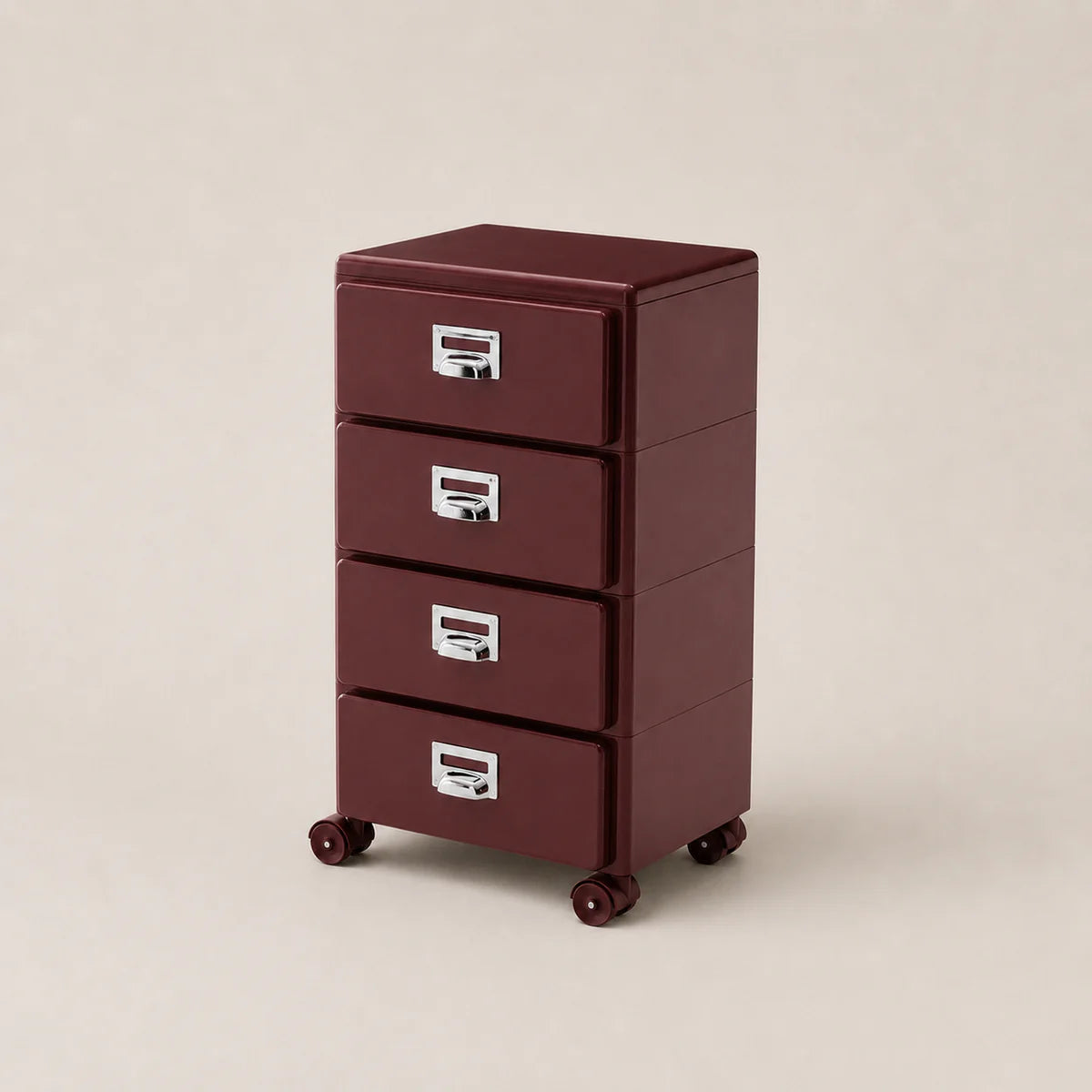 Red metal file cabinet with three drawers on a beige background