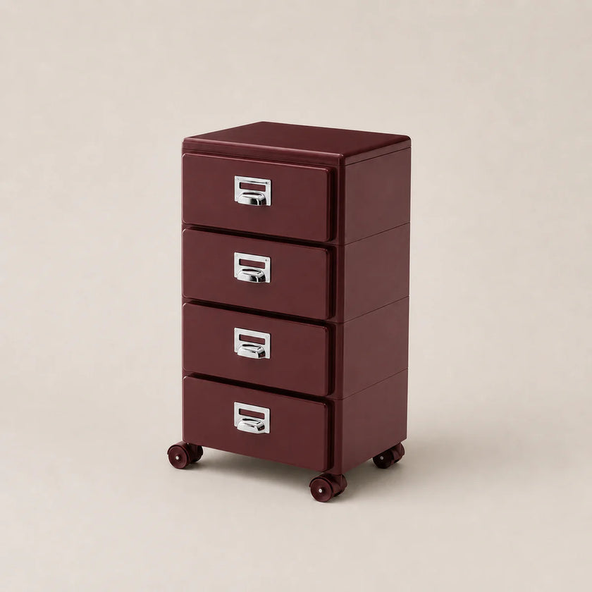 Red metal file cabinet with three drawers on a beige background
