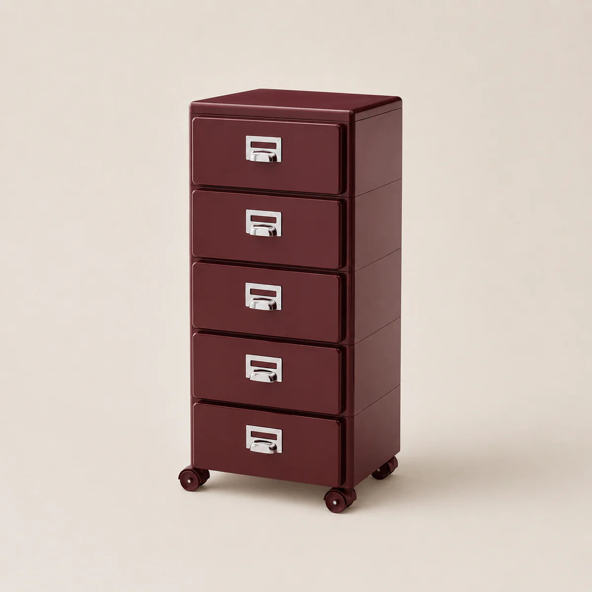 Maroon metal file cabinet with four drawers on a beige background