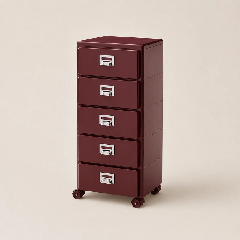 Maroon metal file cabinet with four drawers on a beige background