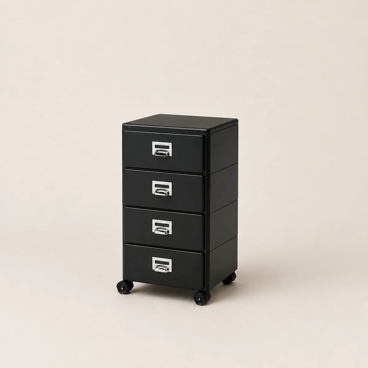 Black metal file cabinet with four drawers on a beige background