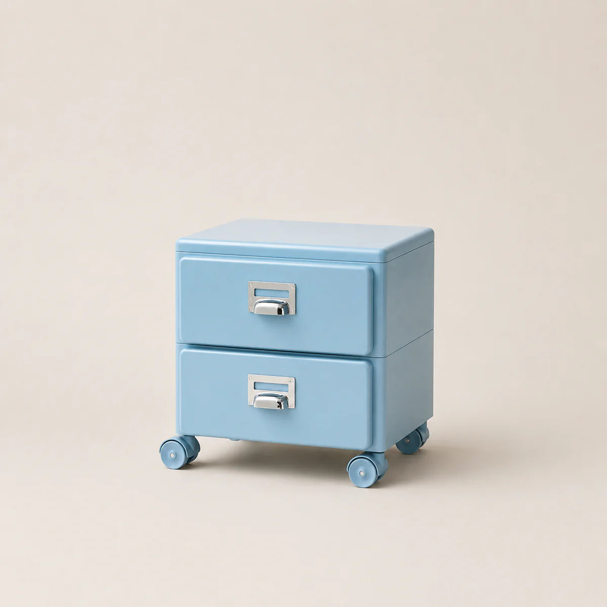 Light blue jewelry box with two drawers on wheels against a beige background