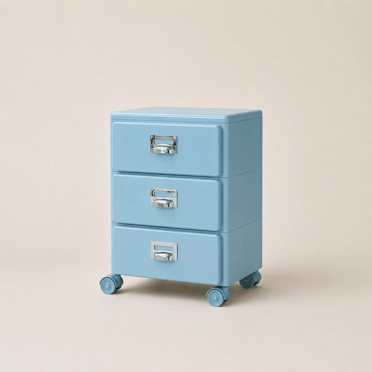Light blue three-drawer filing cabinet on wheels with silver handles against a beige background