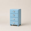 Light blue four-drawer filing cabinet on wheels with silver handles against a beige background