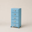 Blue five-drawer filing cabinet on wheels with silver handles against a beige background