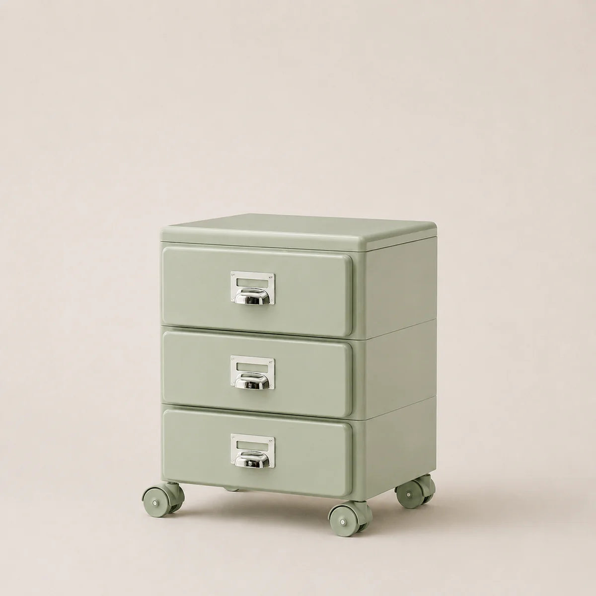 Light green three-drawer filing cabinet on wheels with metallic handles against a beige background