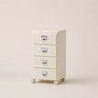 Cream-colored file cabinet with four drawers on a beige background