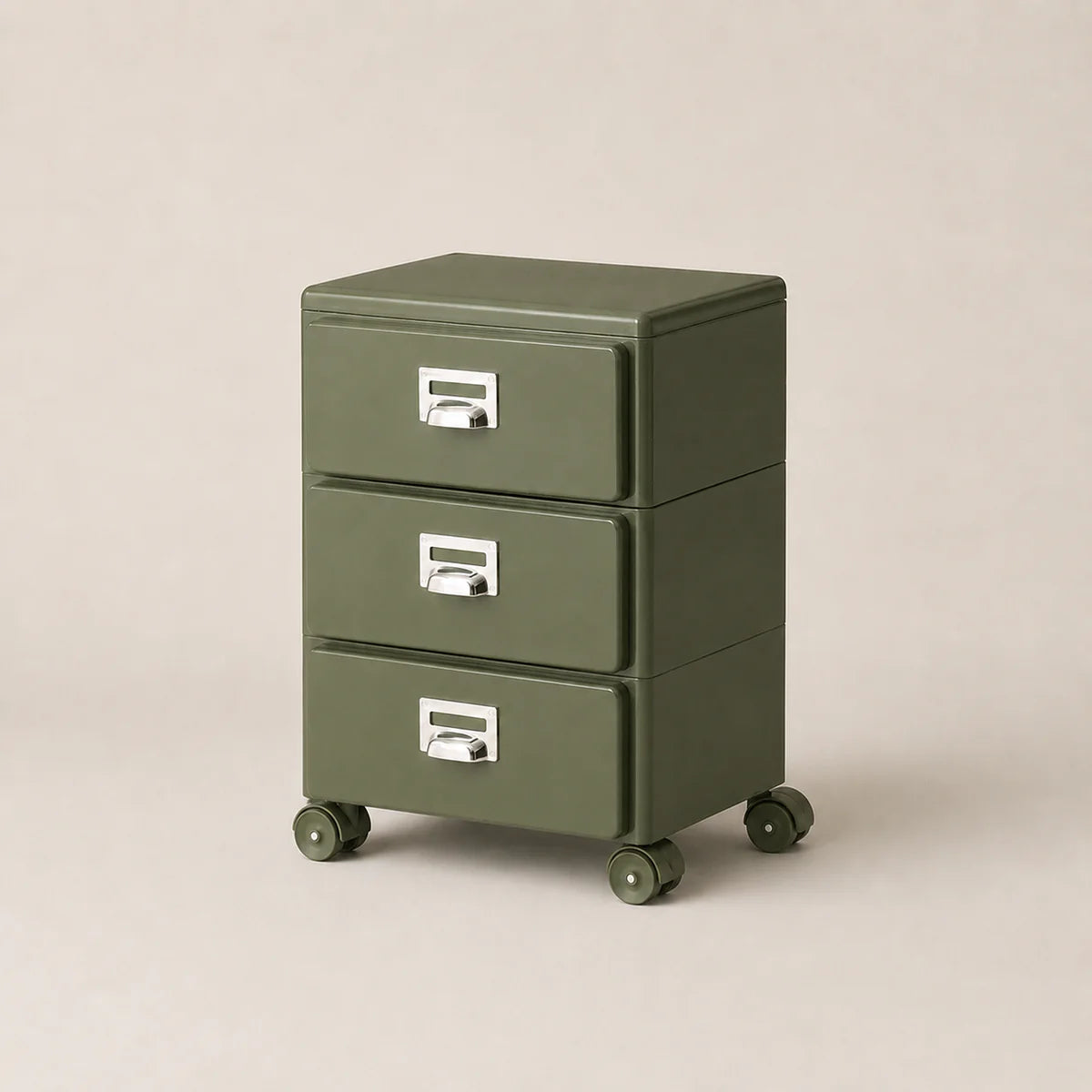 Green three-drawer filing cabinet on wheels with silver handles against a beige background