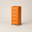 Orange metal file cabinet with four drawers on a beige background