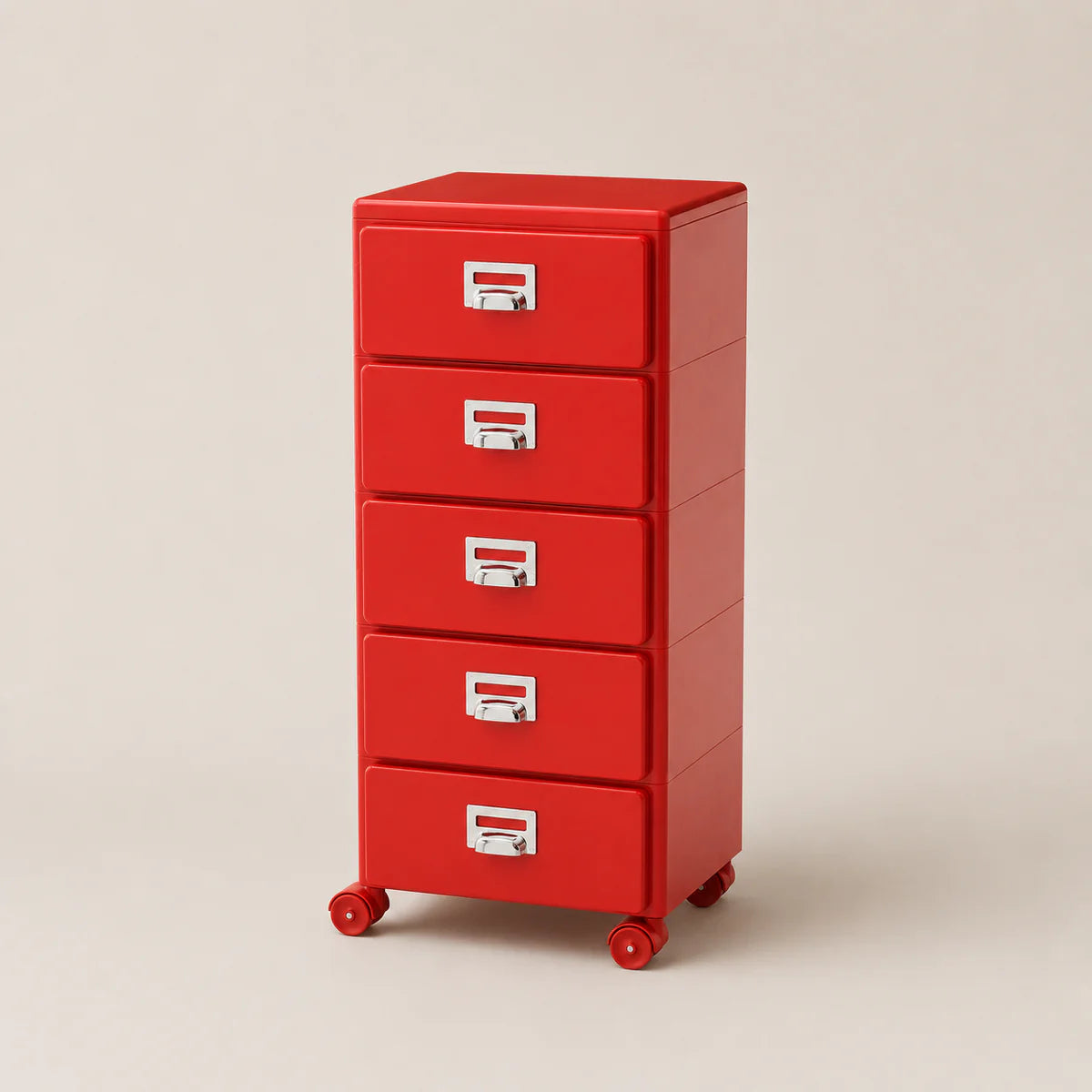 Red metal file cabinet with four drawers on a beige background