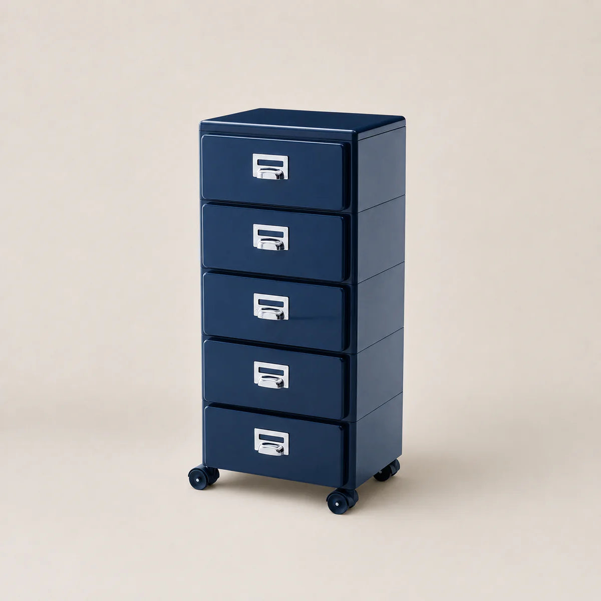 Blue metal storage cabinet with four drawers on wheels against a beige background