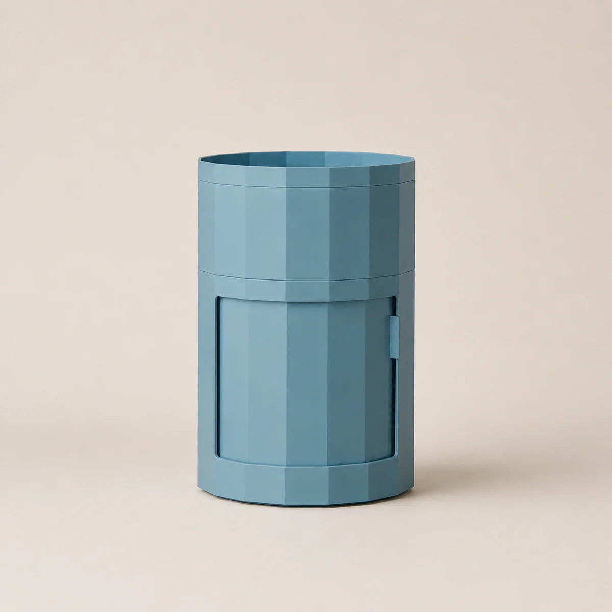 Blue cylindrical container with a striped pattern on a beige background
