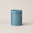 Blue hexagonal container on a beige background