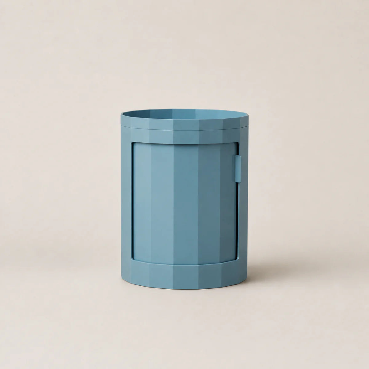 Blue hexagonal container on a beige background